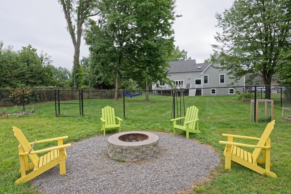 146 7 Bridge Road Lancaster, MA 01523 - Photo 40 of 42 a view of a chair and table in the garden