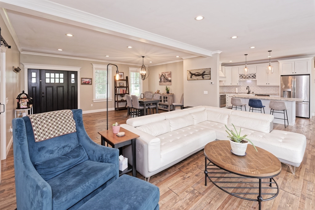 146 7 Bridge Road Lancaster, MA 01523 - Photo 7 of 42 a living room with furniture and kitchen view