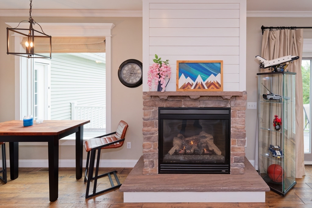 146 7 Bridge Road Lancaster, MA 01523 - Photo 9 of 42 a living room with furniture and a fireplace