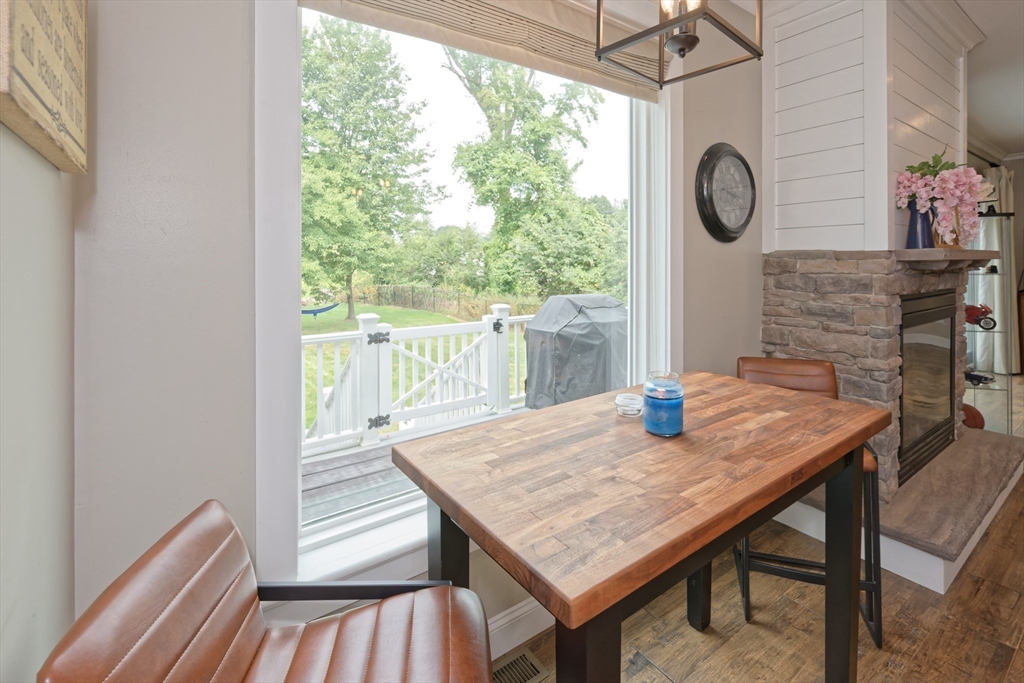 146 7 Bridge Road Lancaster, MA 01523 - Photo 10 of 42 a view of a wooden table and chairs in the patio