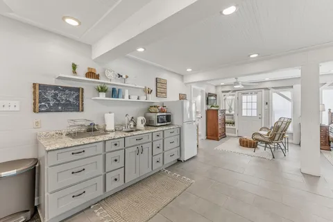 a kitchen with cabinets and window