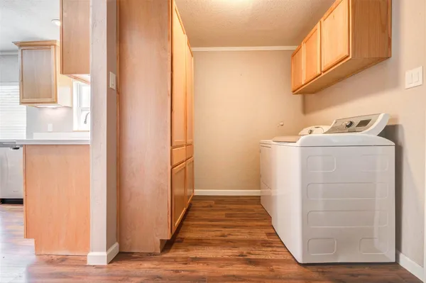 a view of a storage & utility room with a sink