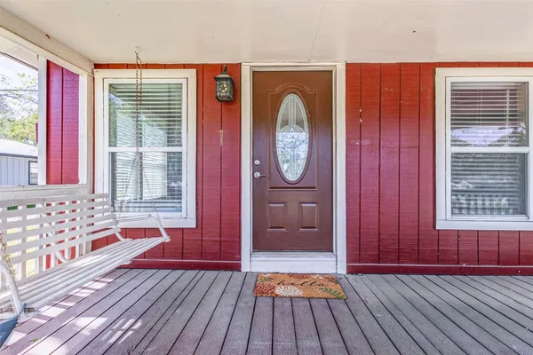 a view of front door with wooden floor