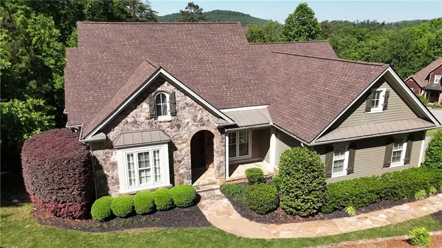 a aerial view of a house with a yard and plants