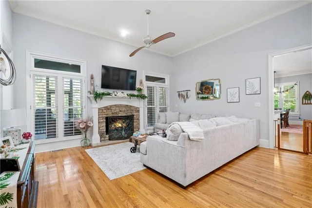 a living room with furniture fireplace and flat screen tv