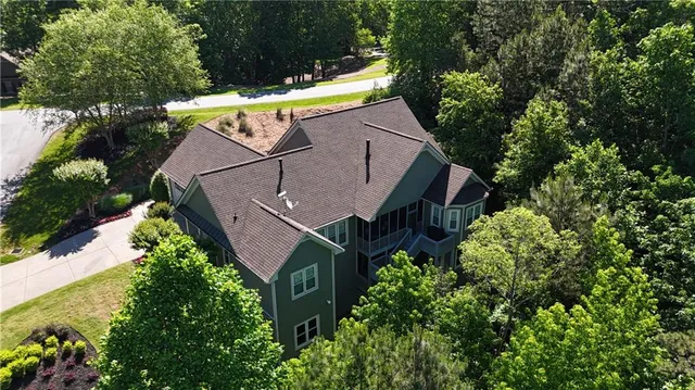 an aerial view of house with yard swimming pool and outdoor seating