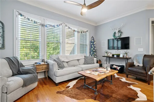 a large white kitchen with lots of counter space a sink appliances and cabinets