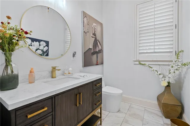 a bedroom with a bed and a flat screen tv on dresser