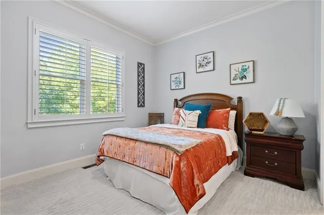 a bed room with a bed and a window