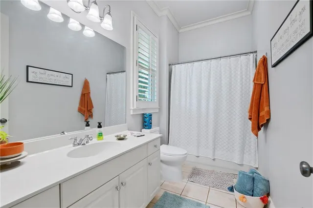 a large bathroom with a double vanity sink a mirror and a shower