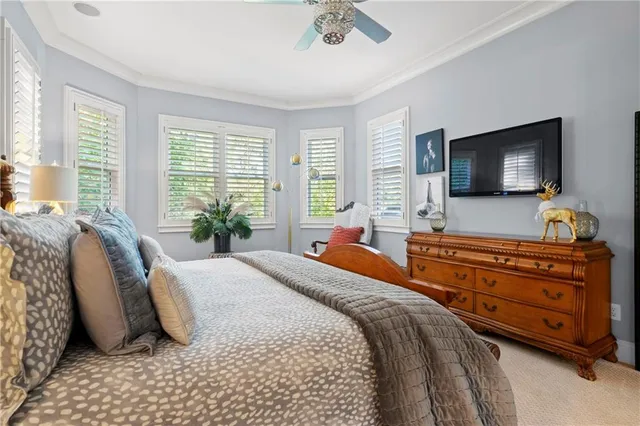 a view of walk in closet with clothes