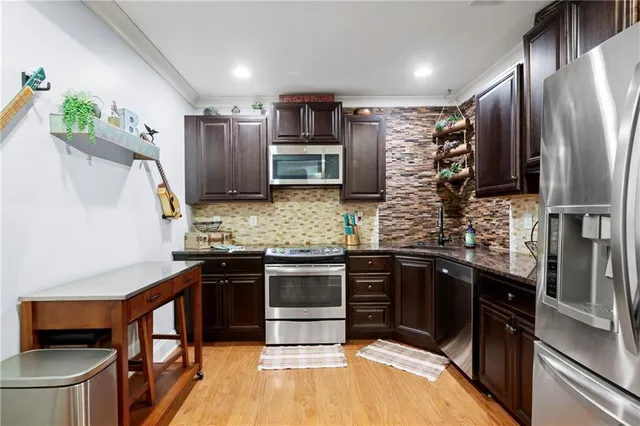 a view of a house with wooden deck