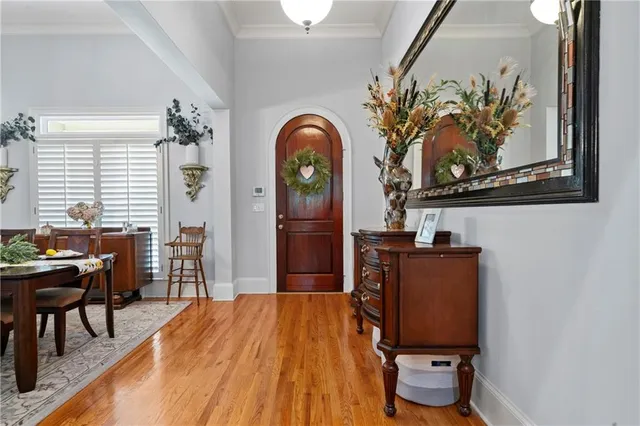 a view of a dining room with furniture and chandelier
