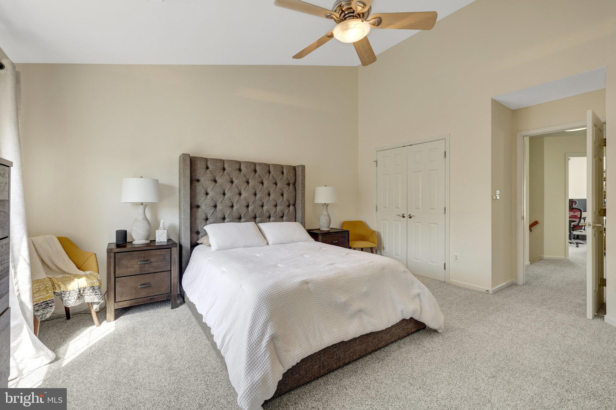 45509 Trail Run Terrace Sterling, VA 20164 - Photo 41 of 64 a bedroom with a bed a chair and potted plant on the dresser