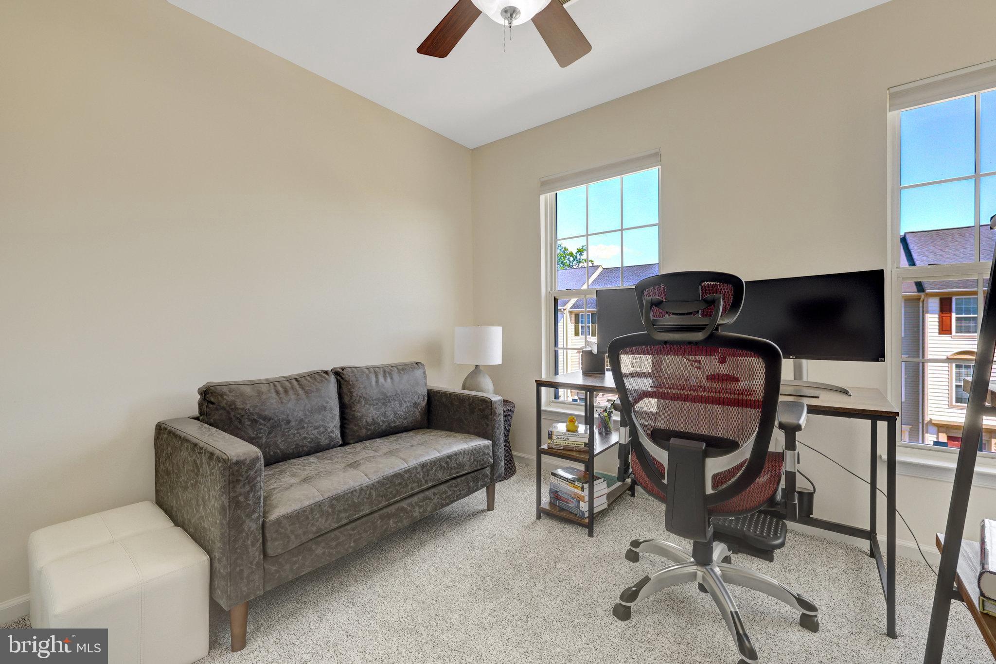 45509 Trail Run Terrace Sterling, VA 20164 - Photo 46 of 64 a living room with furniture a piano and a window