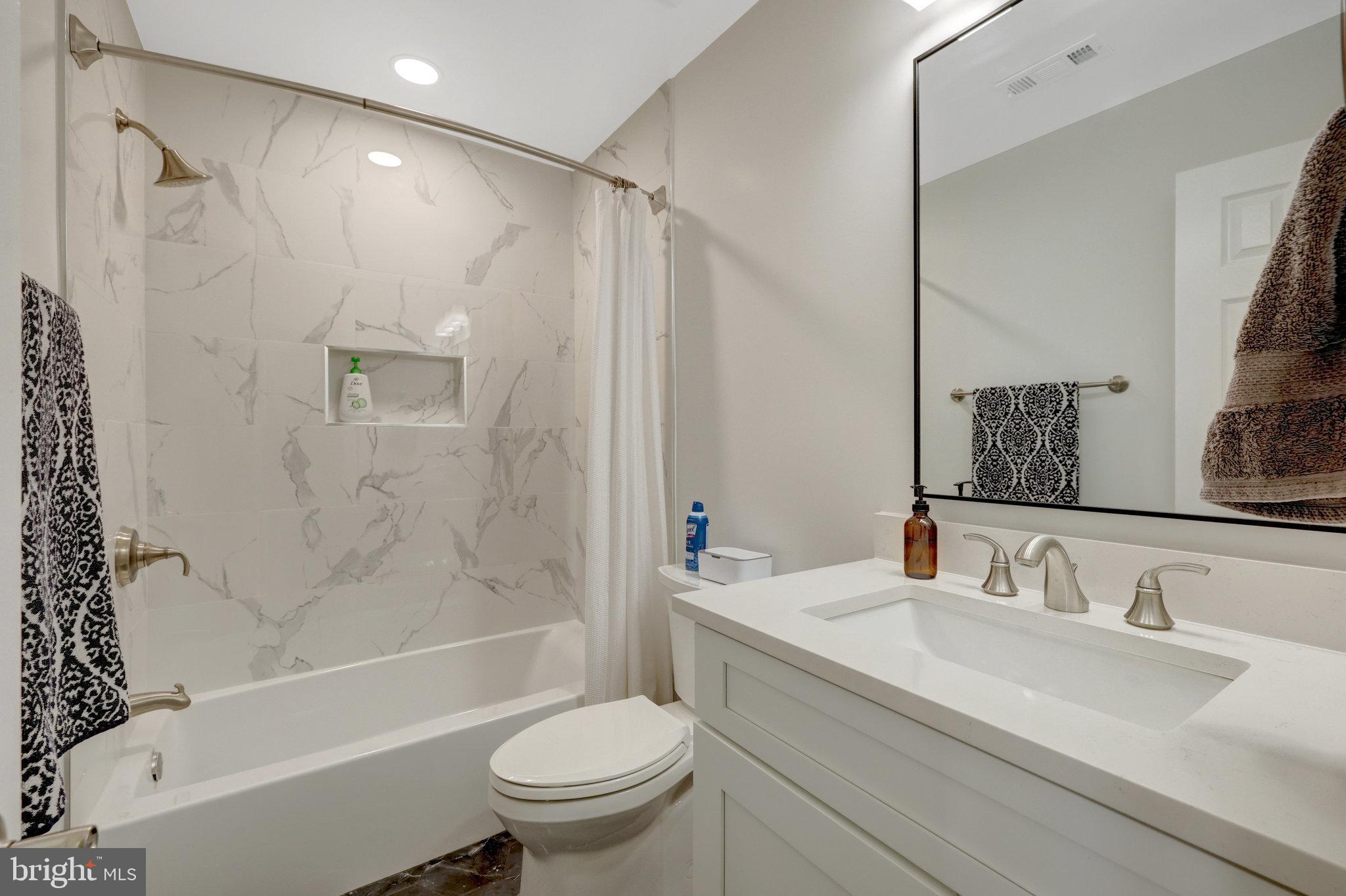 45509 Trail Run Terrace Sterling, VA 20164 - Photo 51 of 64 a bathroom with a granite countertop sink toilet and shower