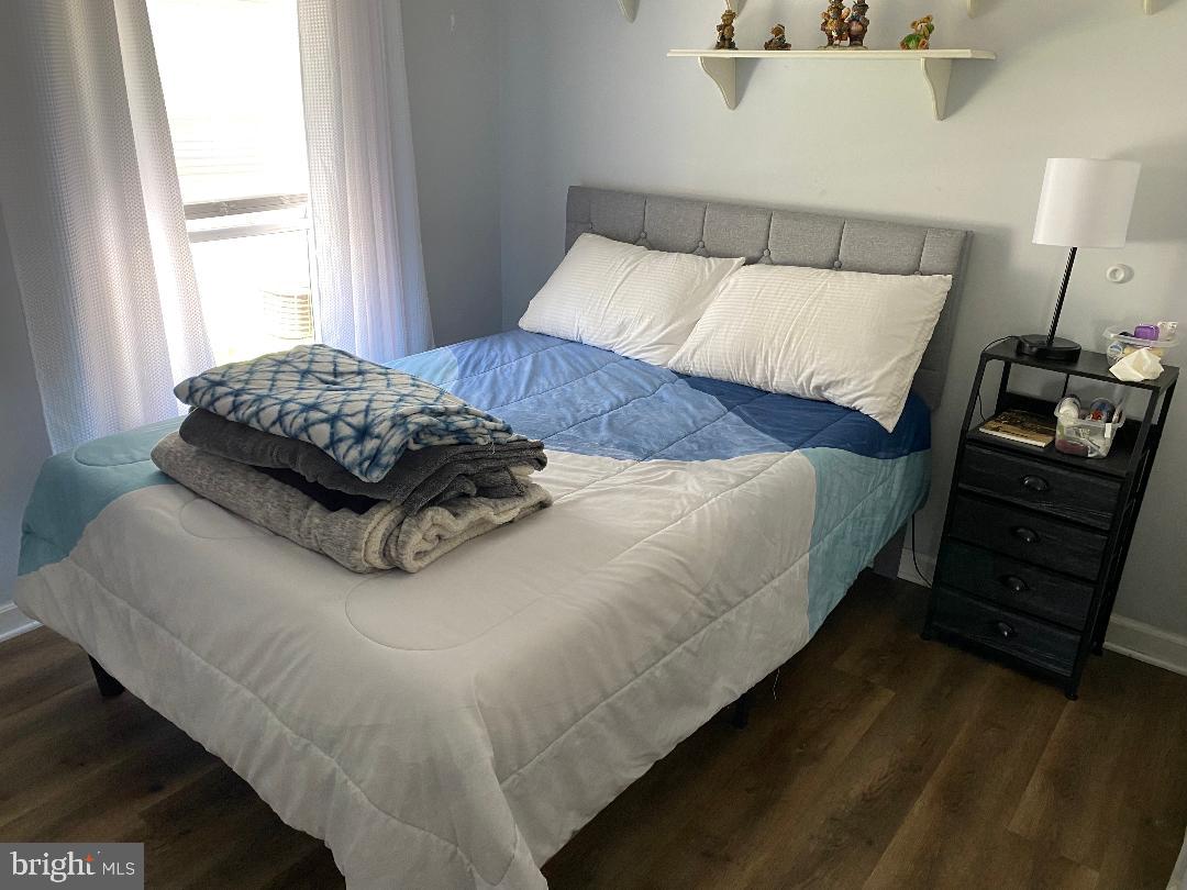 14 Thomas Lane Sparrows Point, MD 21219 - Photo 18 of 26 a bedroom with a bed and a night stand