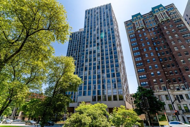 a view of a big yard with lots of green space