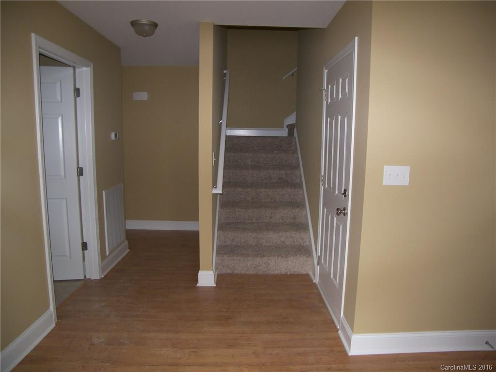 8275 Castor Road, Unit L3 Salisbury, NC 28146 - Photo 17 of 19 a view of a hallway with wooden floor and entryway