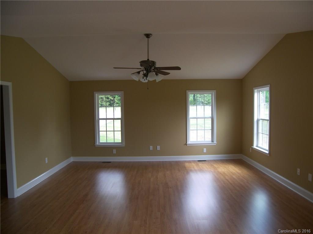 8275 Castor Road, Unit L3 Salisbury, NC 28146 - Photo 9 of 19 a view of a livingroom with wooden floor and a window