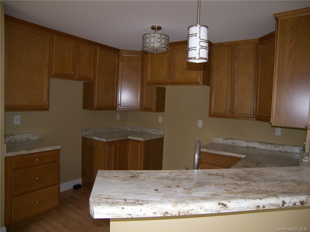 8275 Castor Road, Unit L3 Salisbury, NC 28146 - Photo 10 of 19 a view of a kitchen with granite countertop cabinets