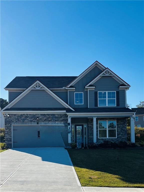 6093 Ruby Falls Lithonia, GA 30038 - Photo 1 of 1 a front view of a house with garden