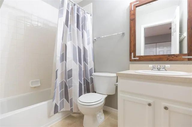 a bathroom with a toilet a sink and a bathtub