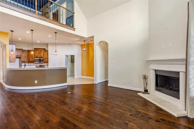 a view of a kitchen with a sink and a fireplace