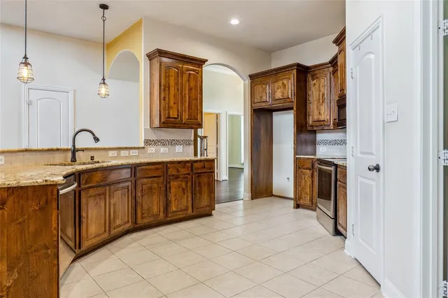 a spacious bathroom with a double vanity sink a mirror and a shower