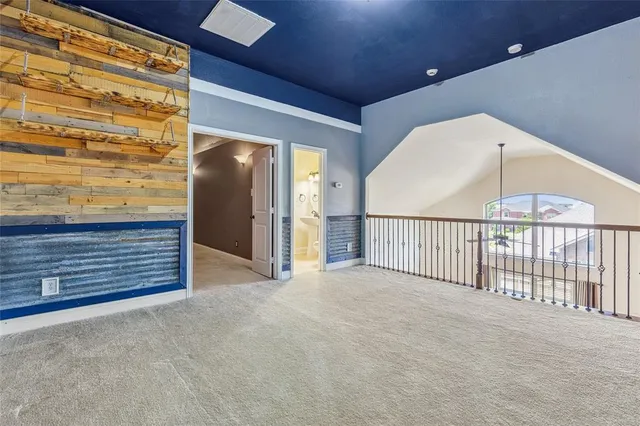 a view of an empty room with a fireplace