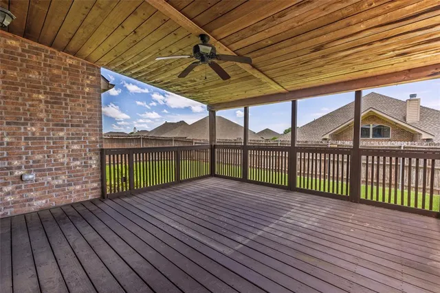 a view of backyard with a deck