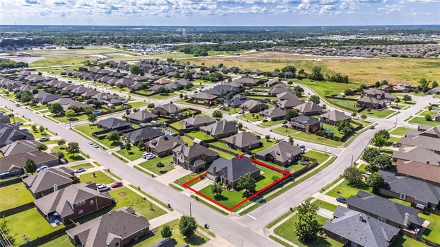 an aerial view of a house with a garden