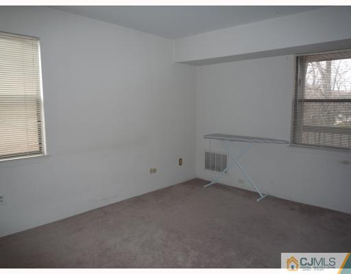 1921 Raspberry Court Edison, NJ 08817 - Photo 5 of 6 an empty room with windows