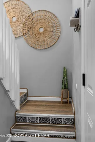 a view of staircase with white walls