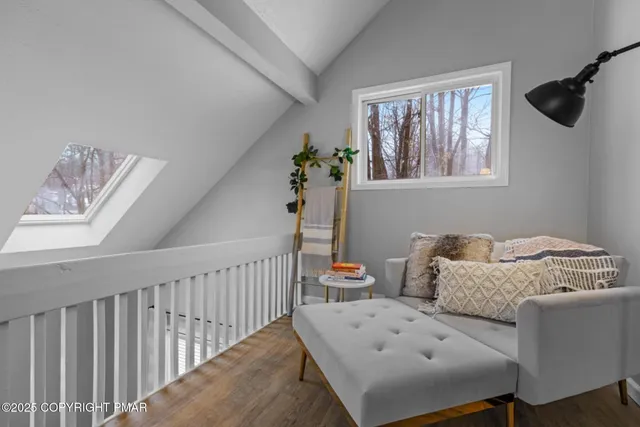 a bedroom with furniture and a window