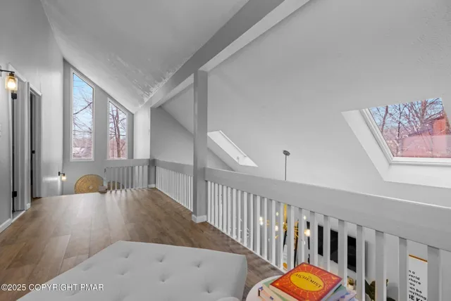 a view of a livingroom with wooden furniture