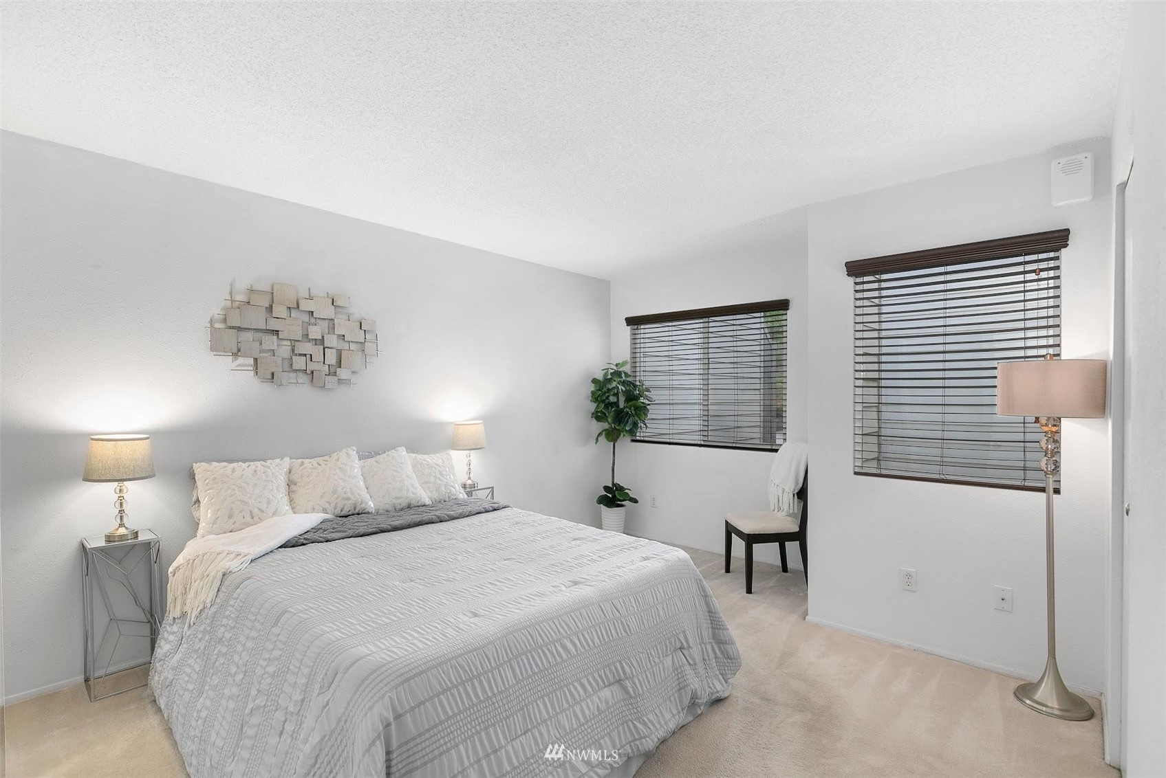 7491 Old Redmond Road, Unit 420 Redmond, WA 98052 - Photo 16 of 25 a bedroom with a bed and a table