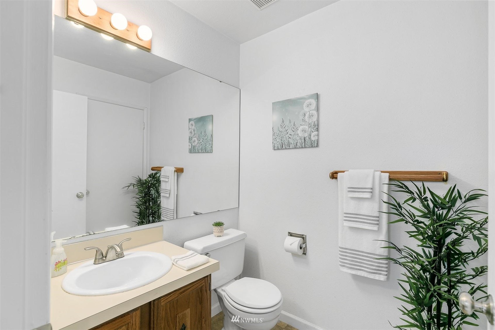 7491 Old Redmond Road, Unit 420 Redmond, WA 98052 - Photo 19 of 25 a bathroom with a toilet a sink and mirror