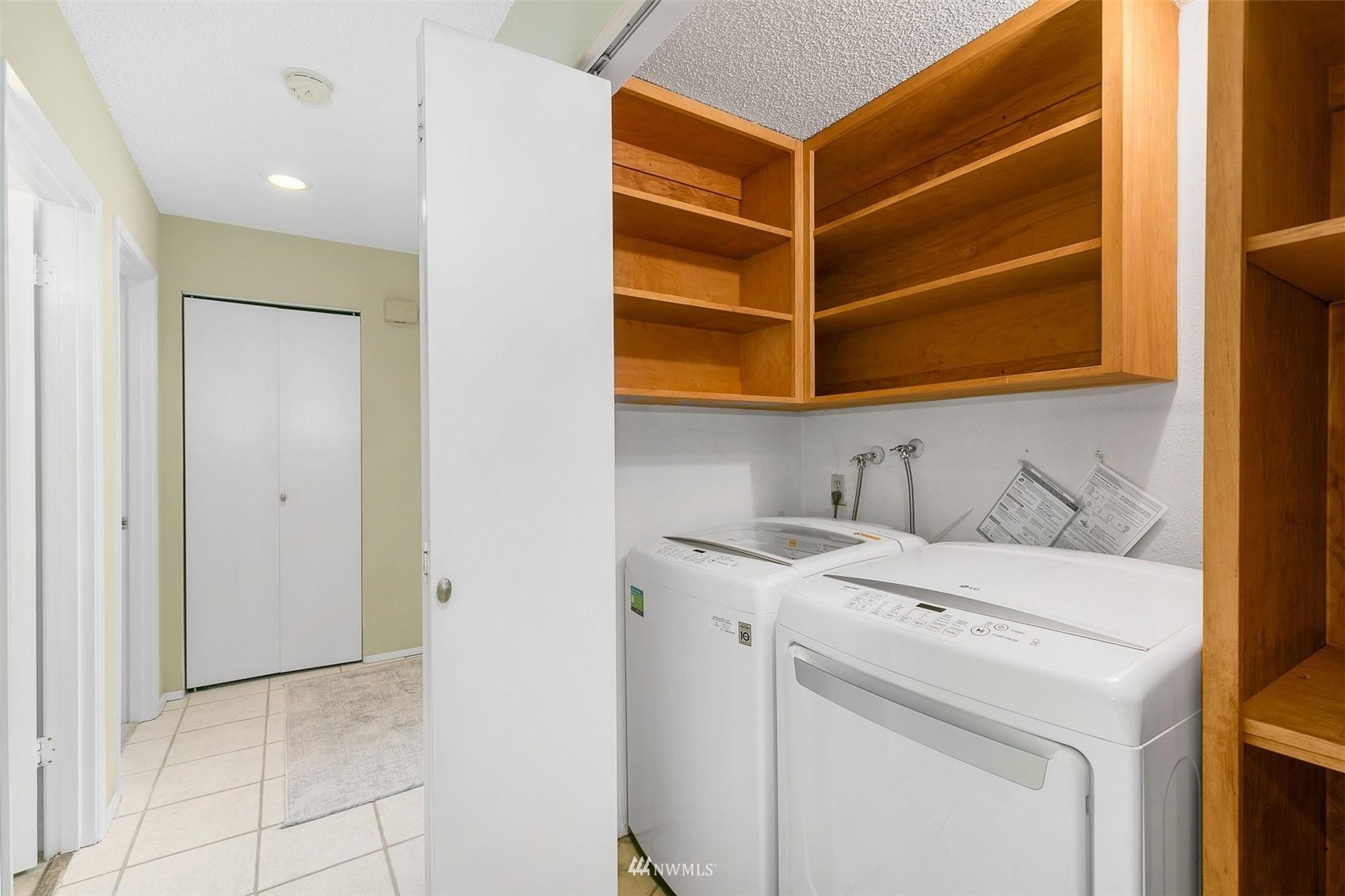7491 Old Redmond Road, Unit 420 Redmond, WA 98052 - Photo 20 of 25 a view of storage and utility room with washer and dryer