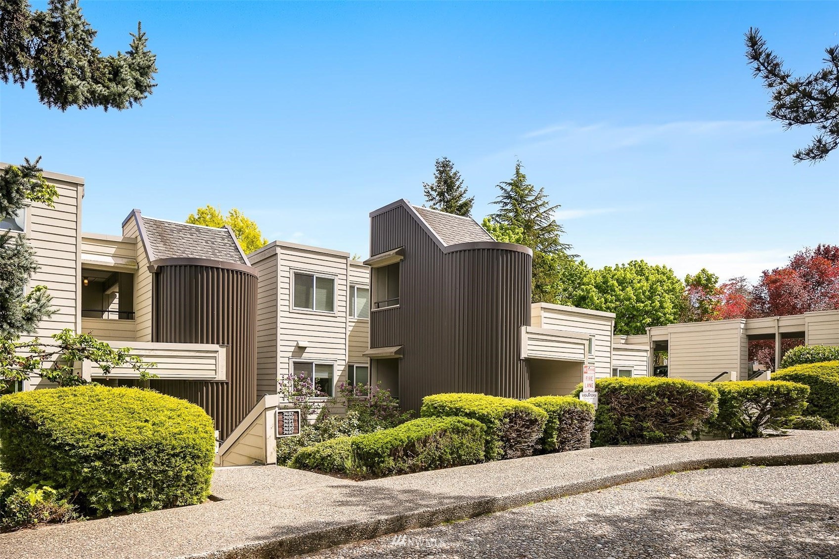 7491 Old Redmond Road, Unit 420 Redmond, WA 98052 - Photo 2 of 25 a front view of a house with a yard