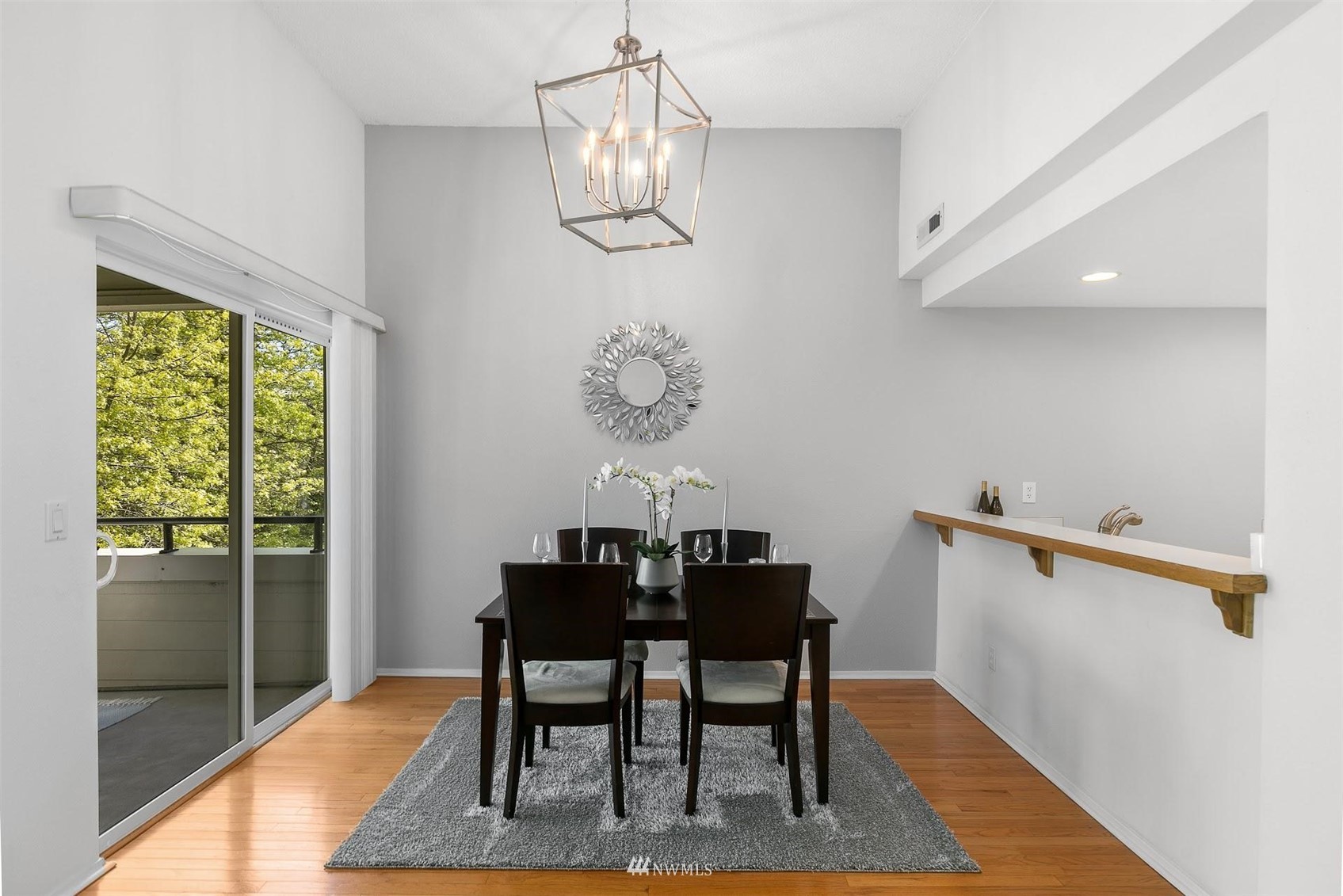 7491 Old Redmond Road, Unit 420 Redmond, WA 98052 - Photo 9 of 25 a view of a dining room with furniture window and wooden floor