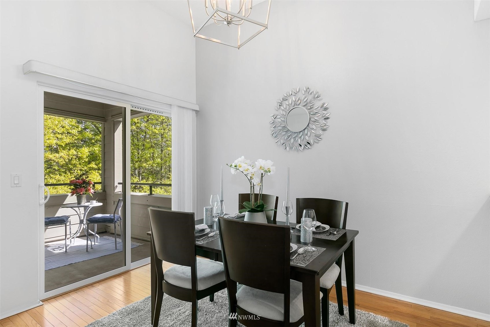 7491 Old Redmond Road, Unit 420 Redmond, WA 98052 - Photo 10 of 25 a view of a dining room with furniture window and wooden floor