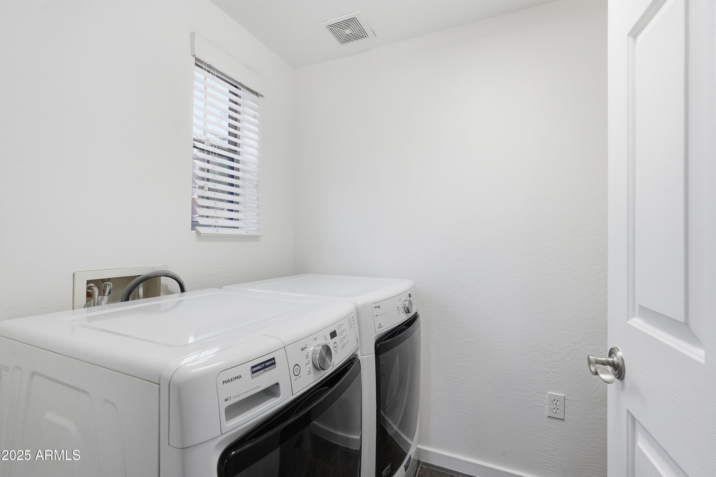 3935 East Rough Rider Road, Unit 1140 Phoenix, AZ 85050 - Photo 15 of 24 a utility room with dryer and washer