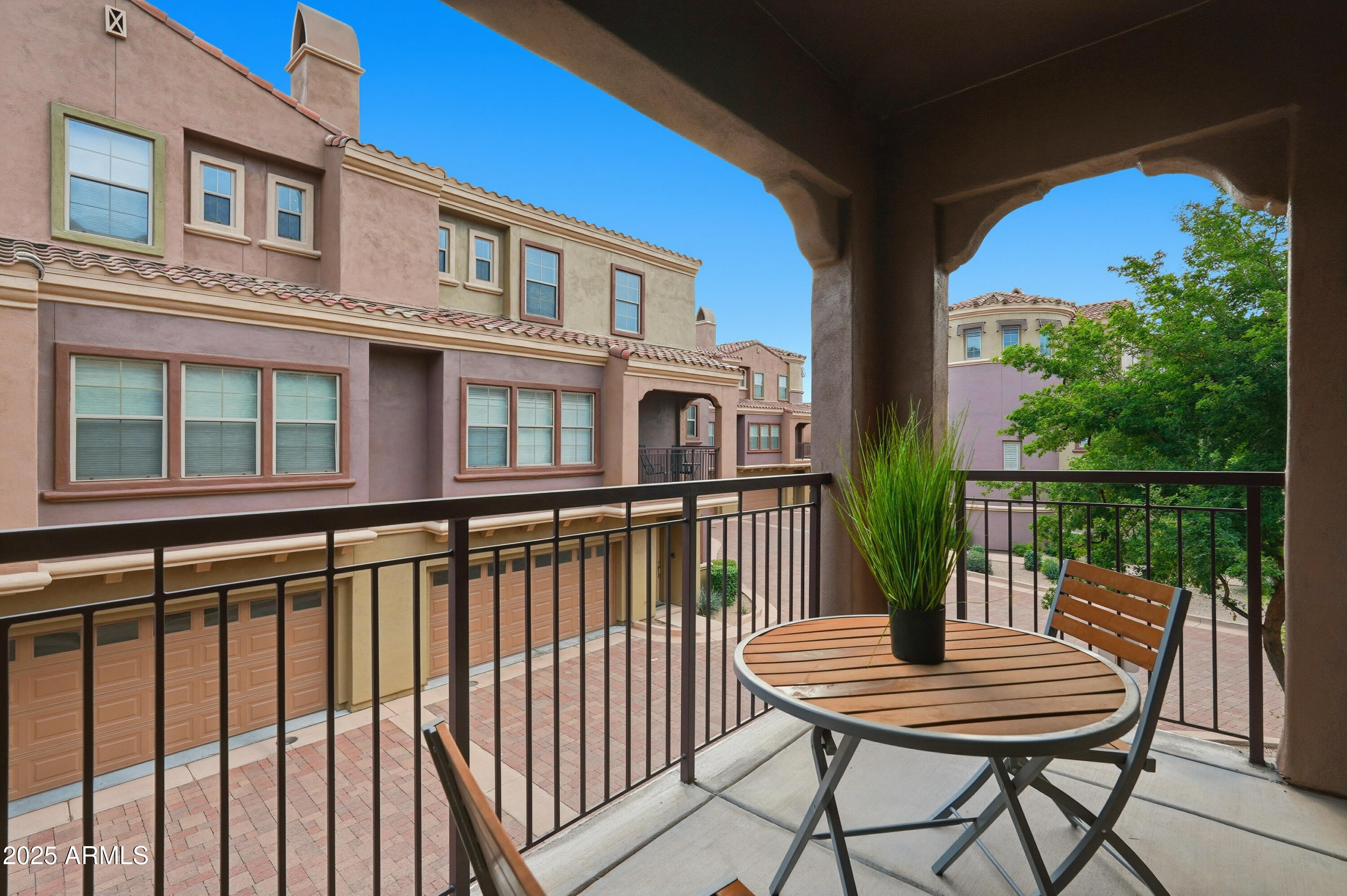3935 East Rough Rider Road, Unit 1140 Phoenix, AZ 85050 - Photo 17 of 24 a balcony view with a seating space