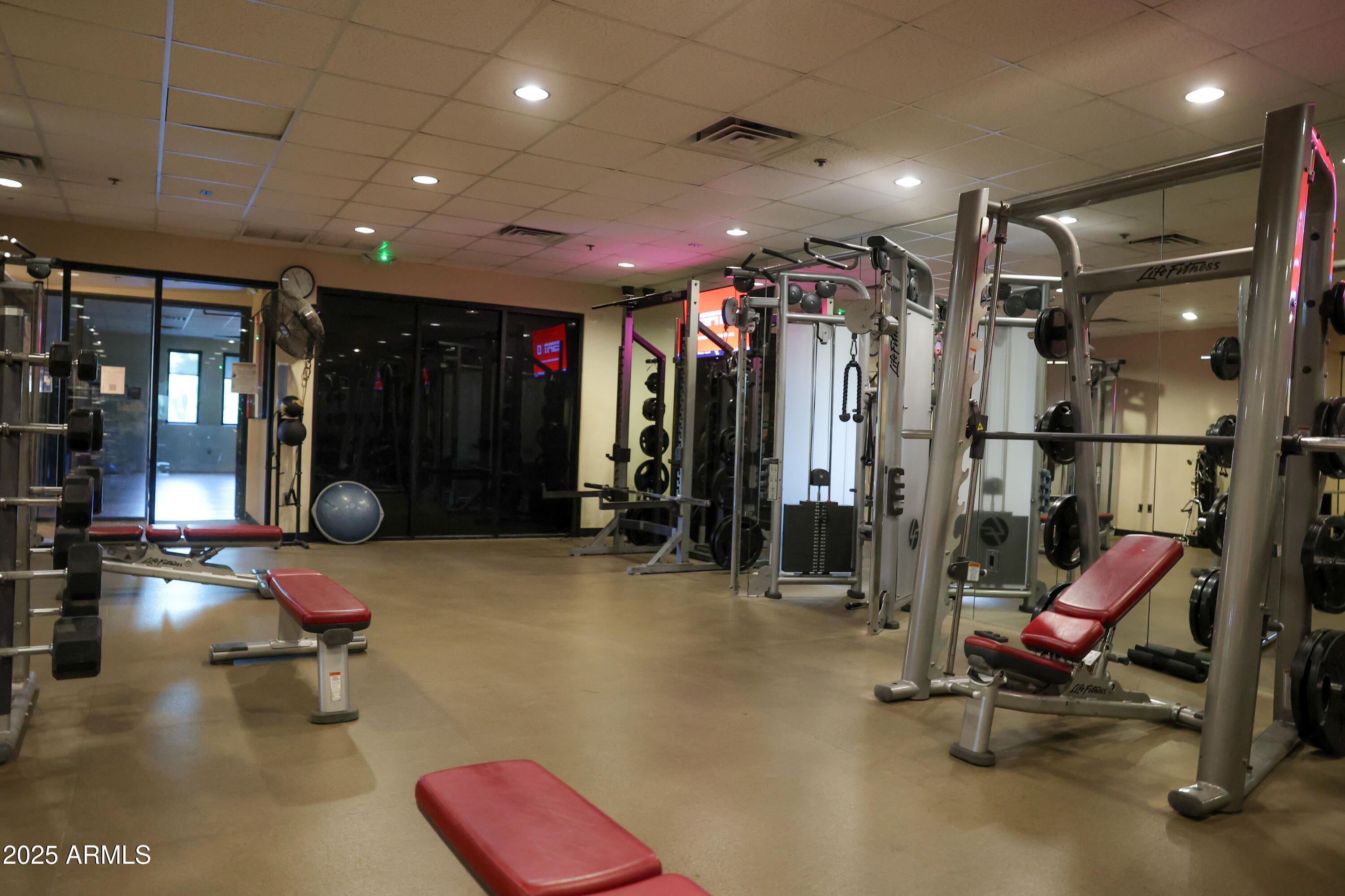 3935 East Rough Rider Road, Unit 1140 Phoenix, AZ 85050 - Photo 21 of 24 a view of a room with gym equipment