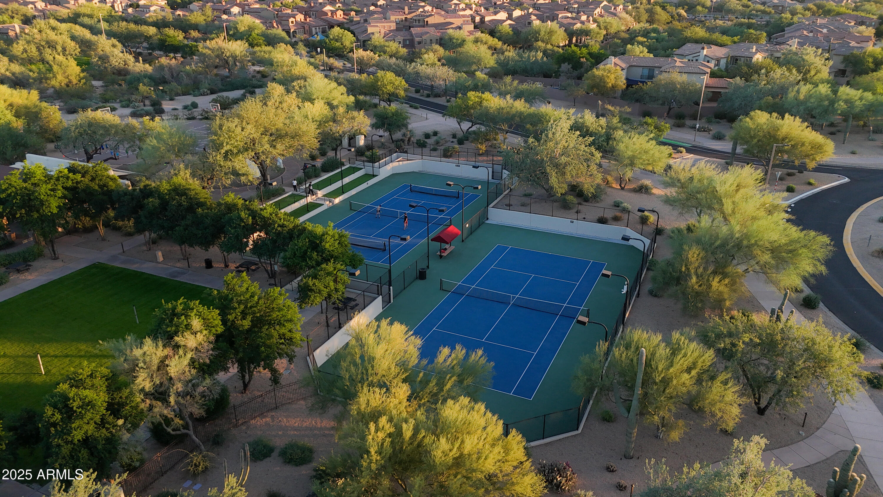 3935 East Rough Rider Road, Unit 1140 Phoenix, AZ 85050 - Photo 23 of 24 a view of house along with trees
