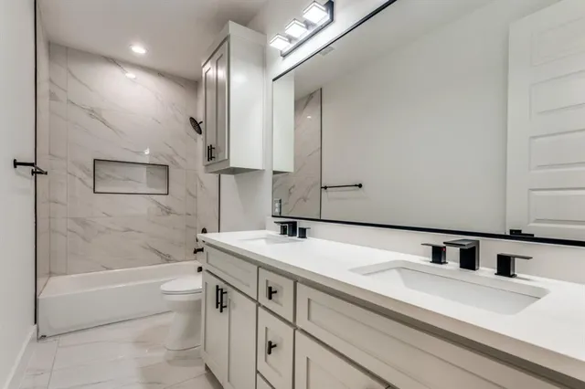 a bathroom with a sink a bathtub and a shower
