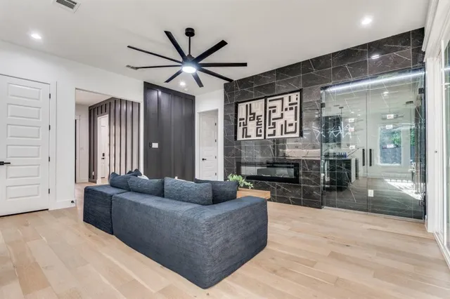 a living room with furniture and a large window