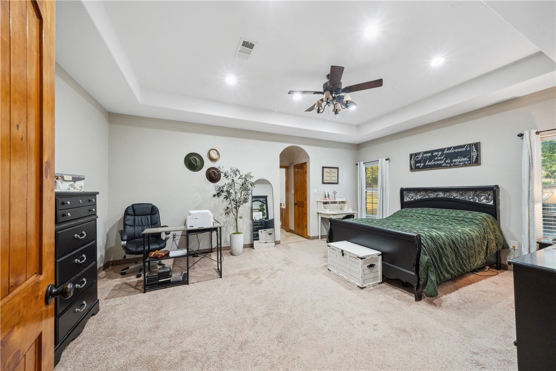 740 Bridget Avenue Buffalo, TX 75831 - Photo 16 of 42 a bedroom with furniture and a chandelier