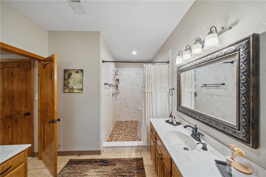 740 Bridget Avenue Buffalo, TX 75831 - Photo 17 of 42 a bathroom with a tub a sink and shower